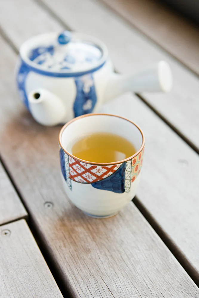 A pot and cup of green tea