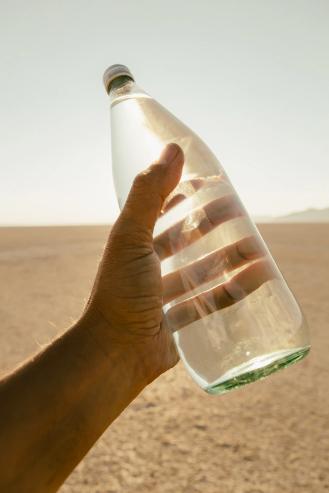hand holding a bottle of water