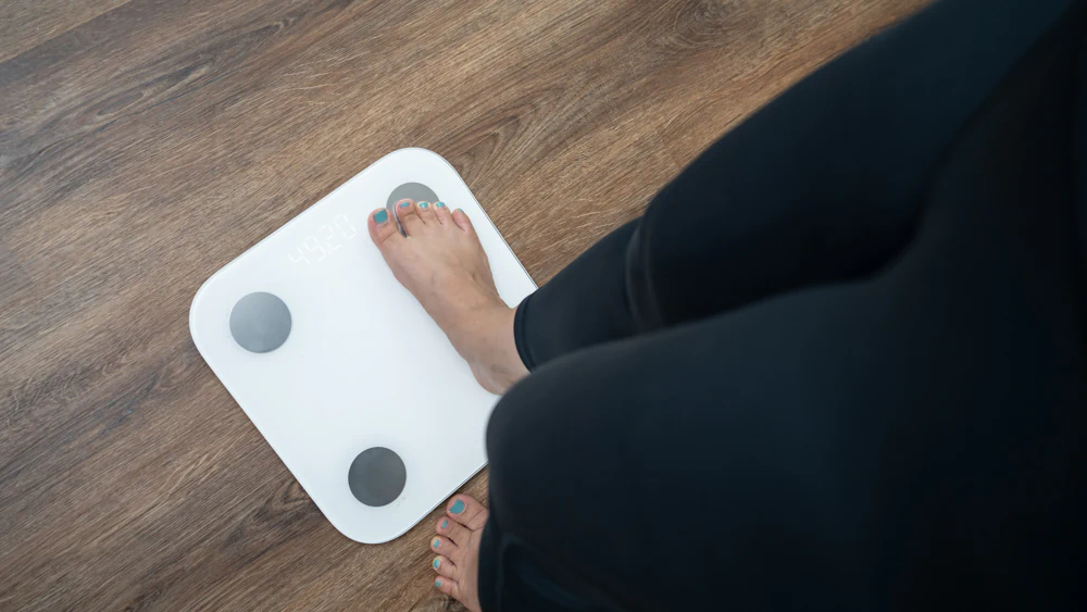 woman-on-a-scale-illustrating-weight-loss